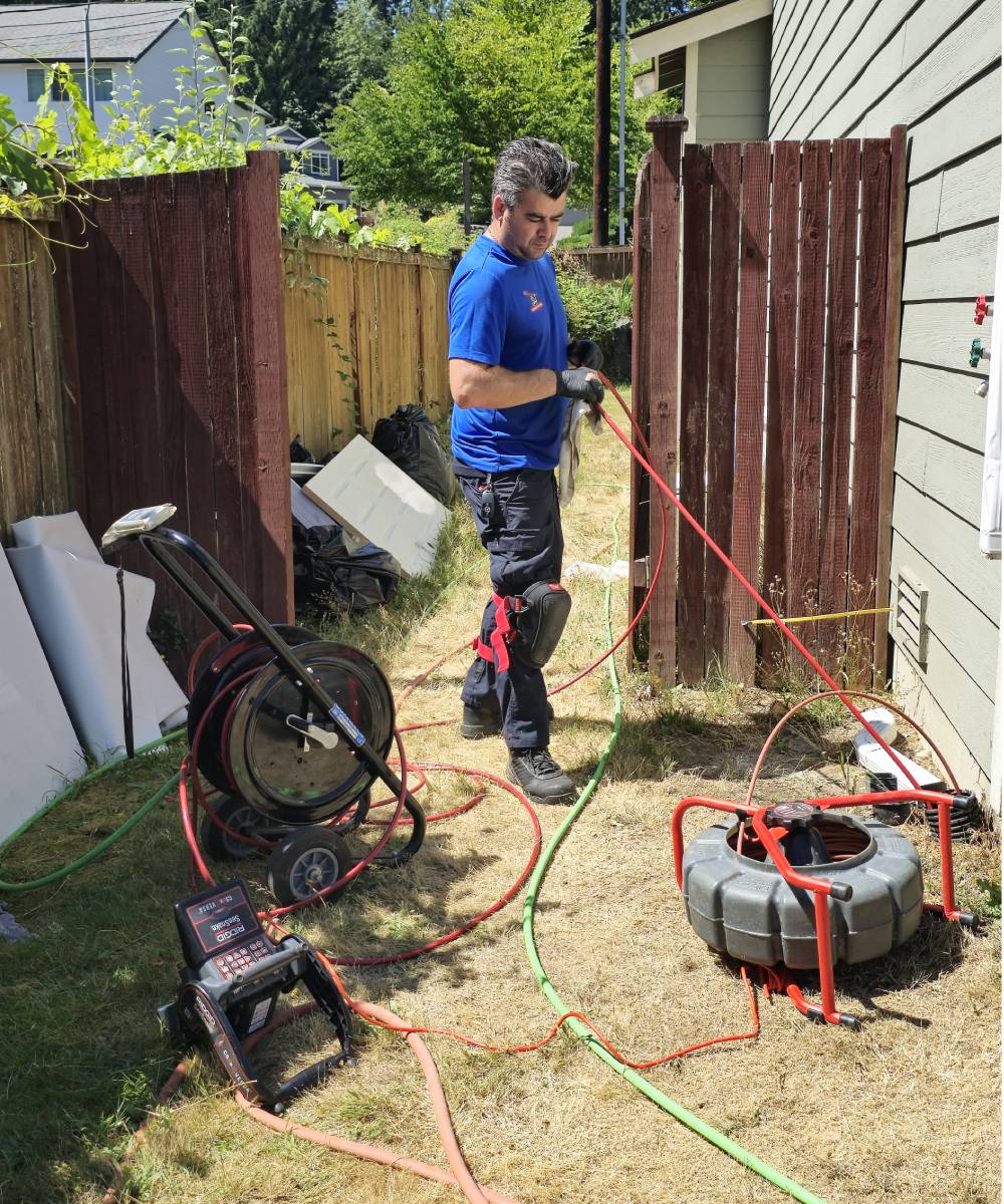 Knight Rooter technician using advanced camera inspection to diagnose a sewer line issue in Seattle, WA.