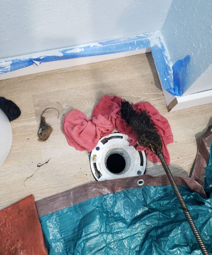 Professional drain cleaning: A technician performing hydro jetting for drain cleaning in a seattle home.