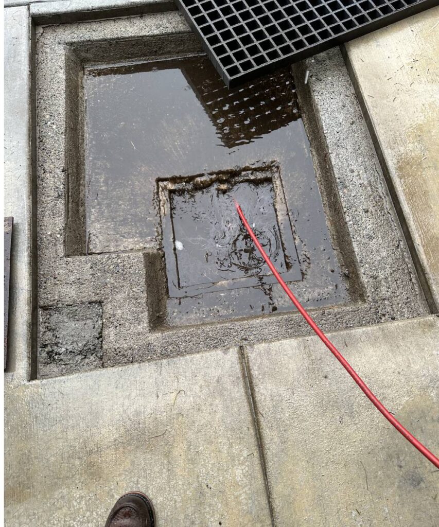 Eco-friendly plumbing technician performing hydro jetting