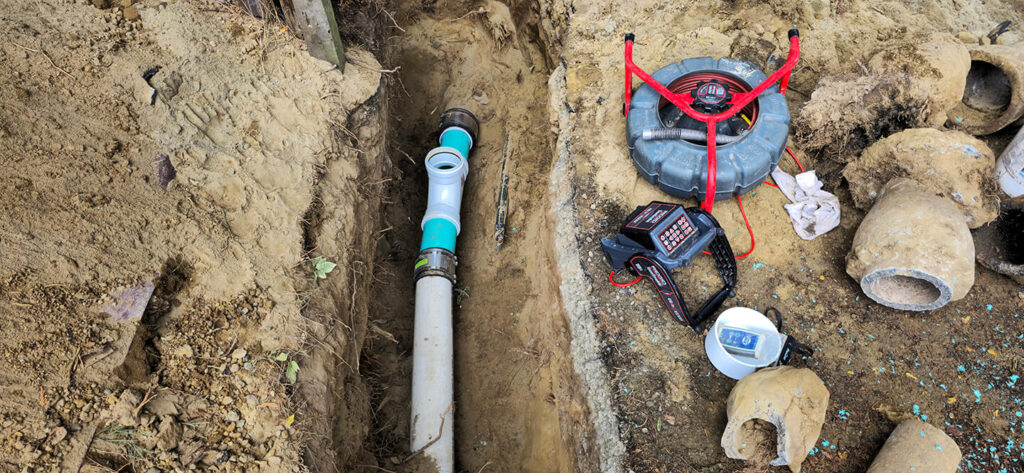 Seattle plumbing team inspecting hillside sewer system