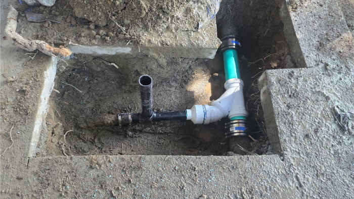 Preserved residential yard after trenchless pipe lining repair.  
