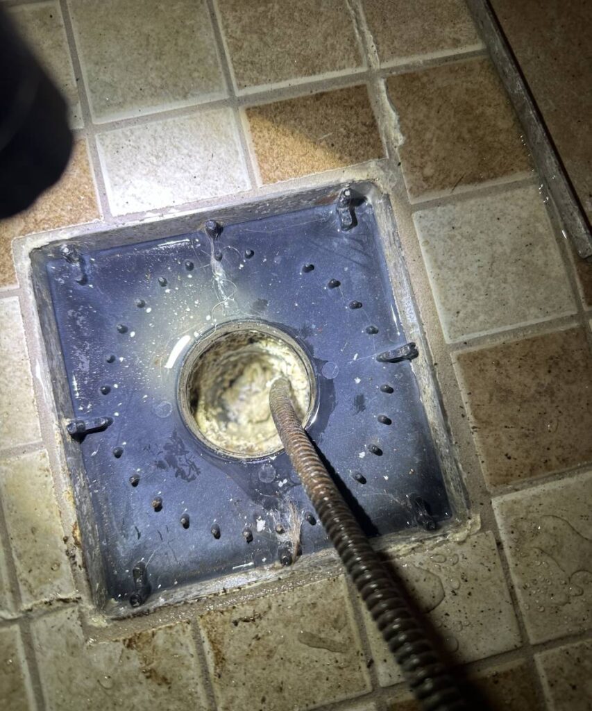 KnightRooter expert performing hydro jetting in kitchen
